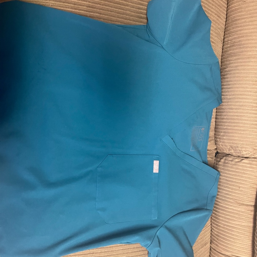 FIS single pocket Casma. worn once. ni stain, marks.Caribbean blue color